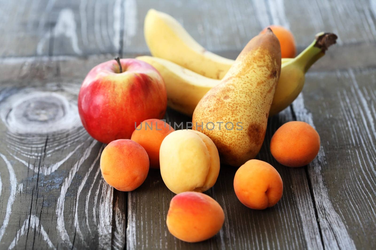 Heap of freshness fruits on old wooden board