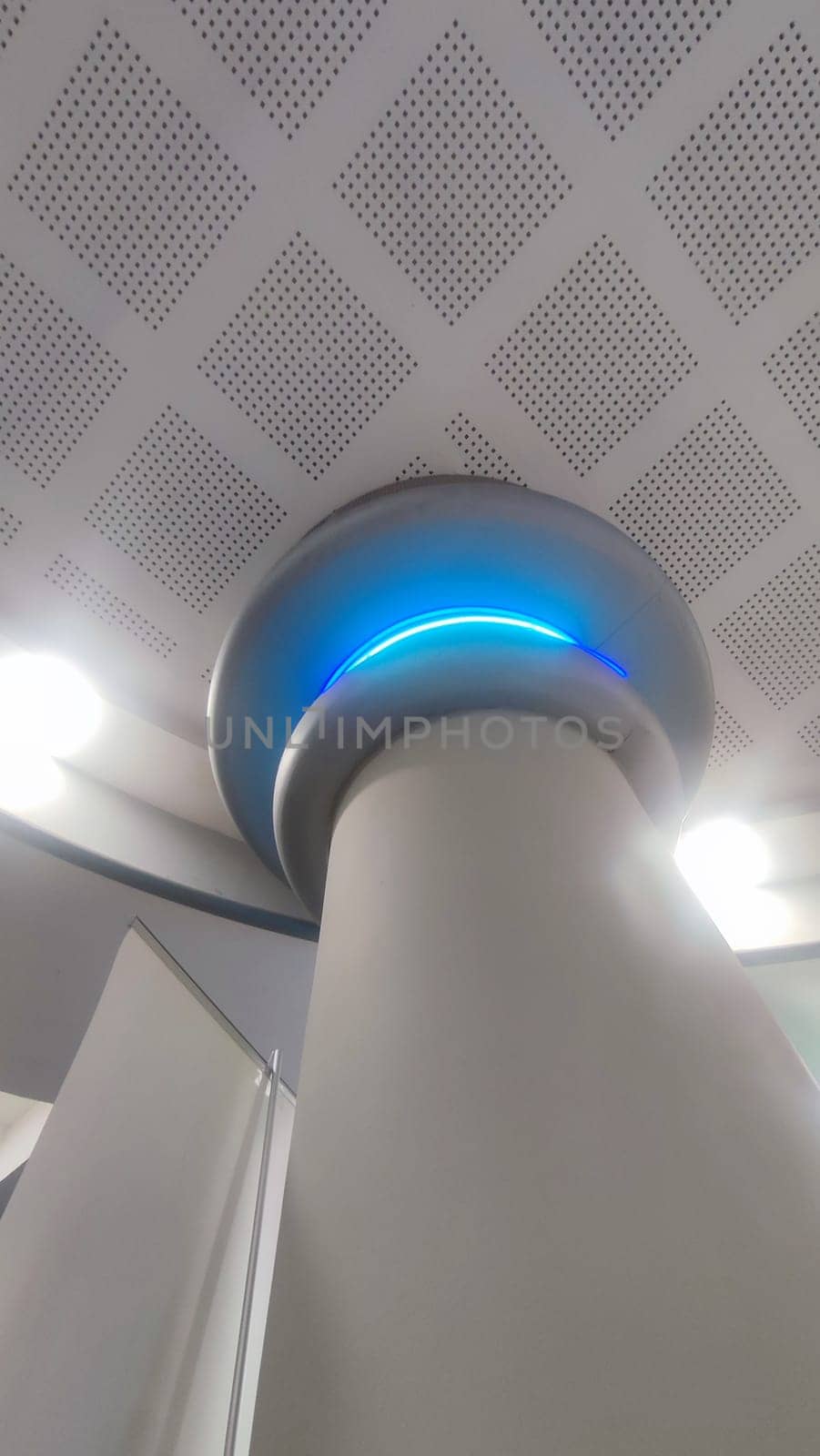 white column, interior design, structures inside, blue light lamp. High quality photo