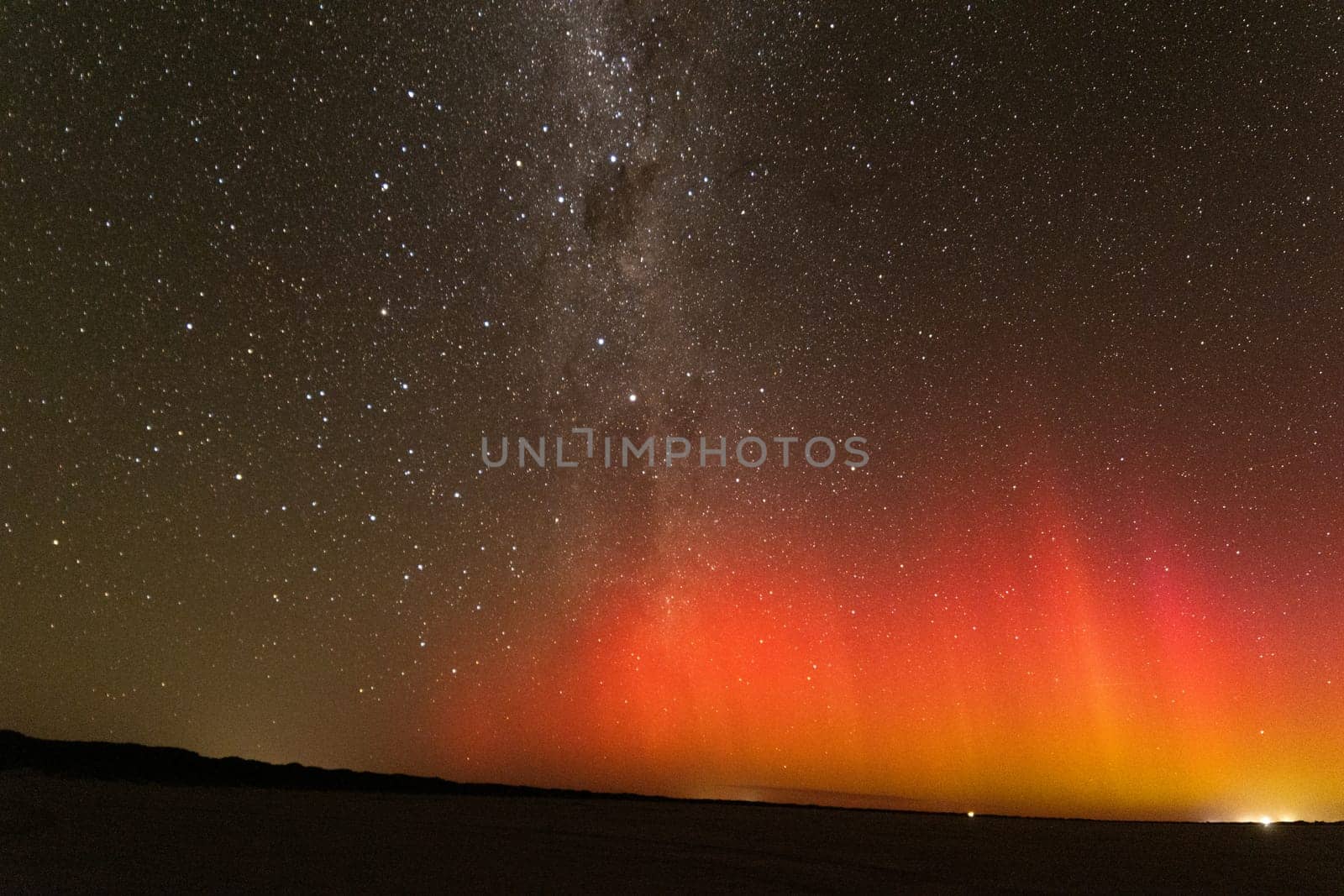 Bright red burst of Aurora Australis and milky way, Southern Australia by StefanMal