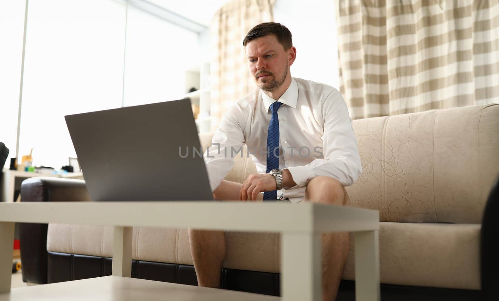 Concentrated man using pc by kuprevich