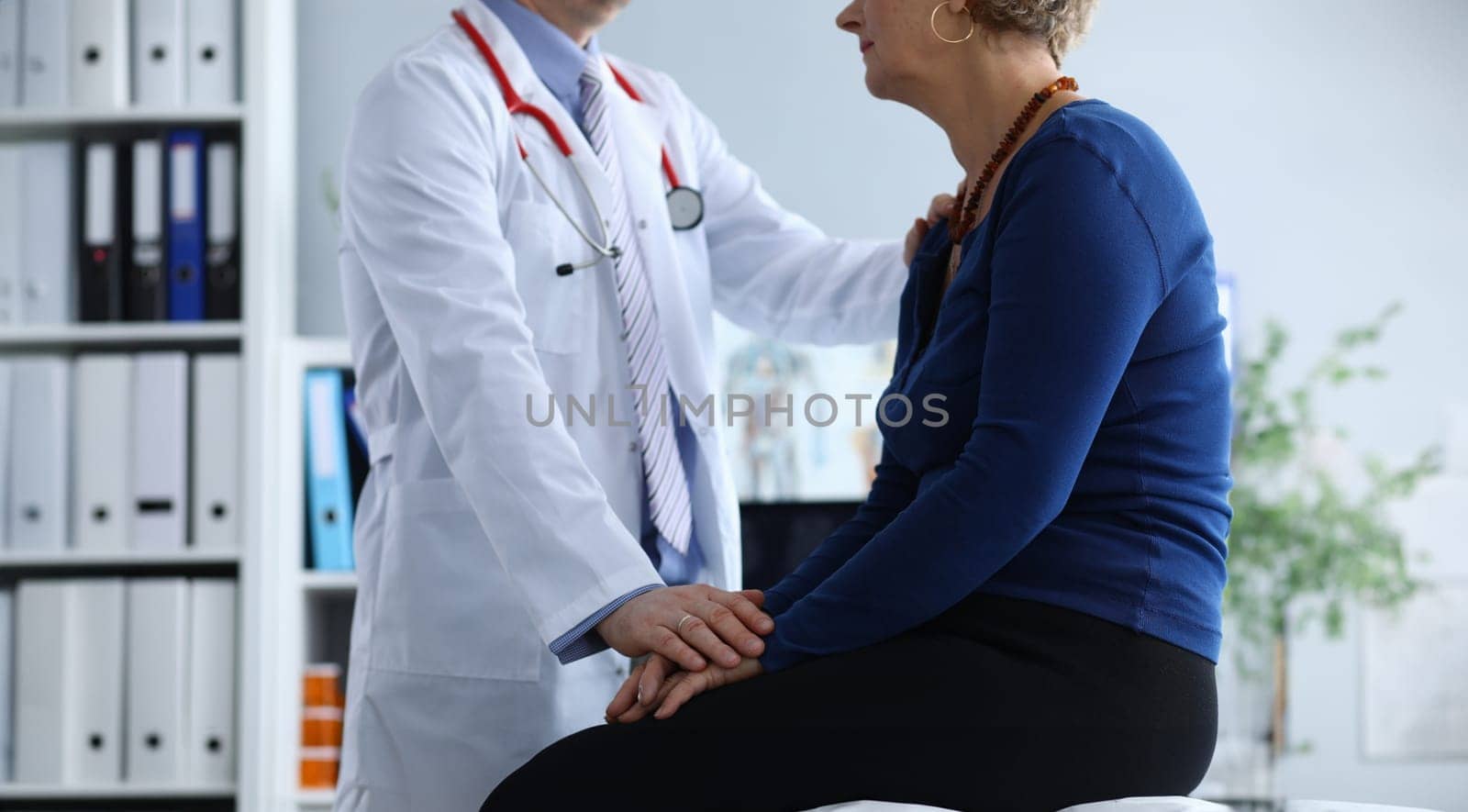 Close-up of unhealthy woman on appointment with therapist. Doctor in uniform making examination of sick elderly lady. Health care, treatment and medicine concept