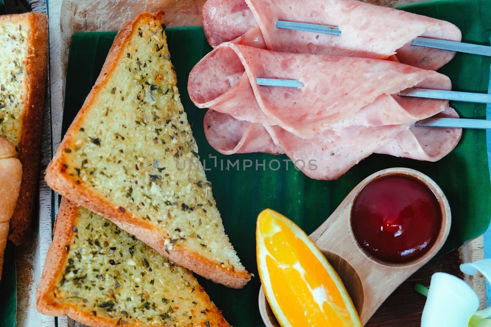 Breakfast with toast bread and ham on wooden tray