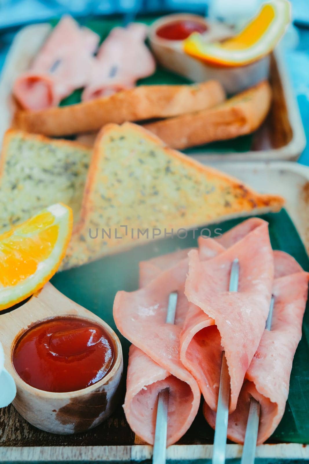 Breakfast with toast bread and ham on wooden tray