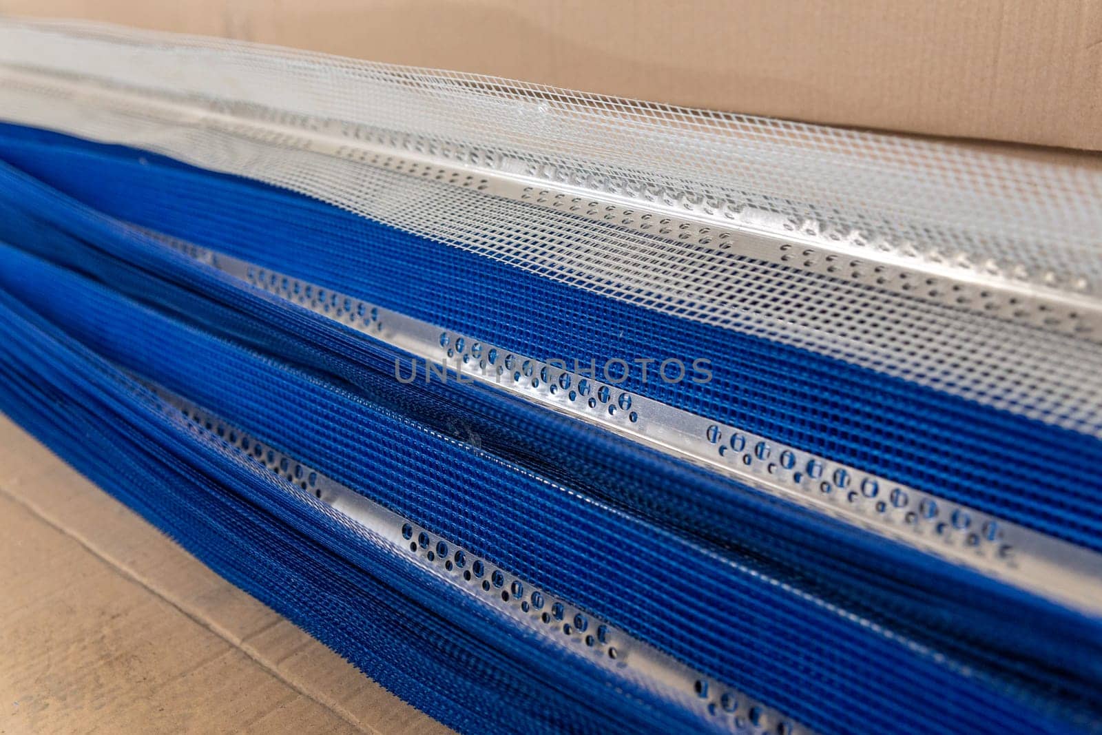 Aluminum perforated corner beads with PVC grid in construction materials market