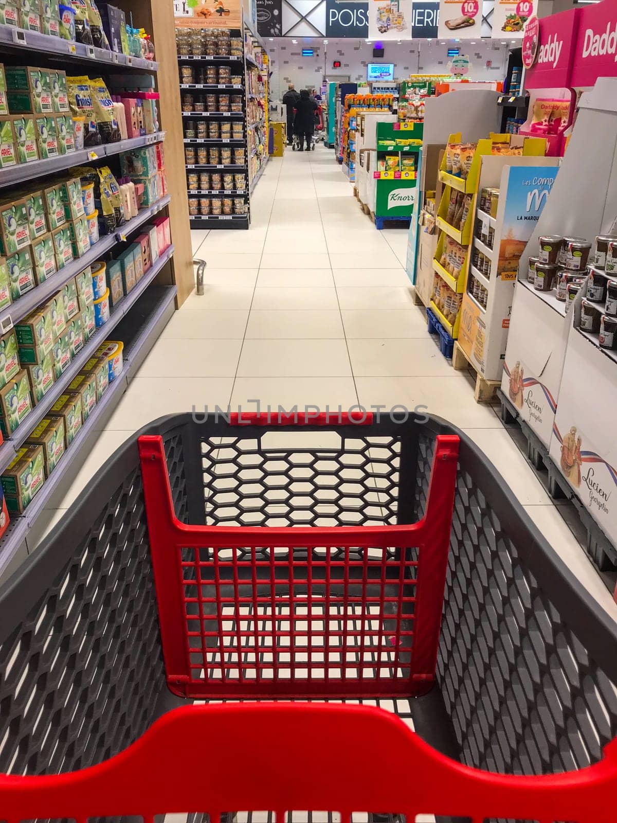 Caddy in a supermarket in front of packs of milk, High quality photo