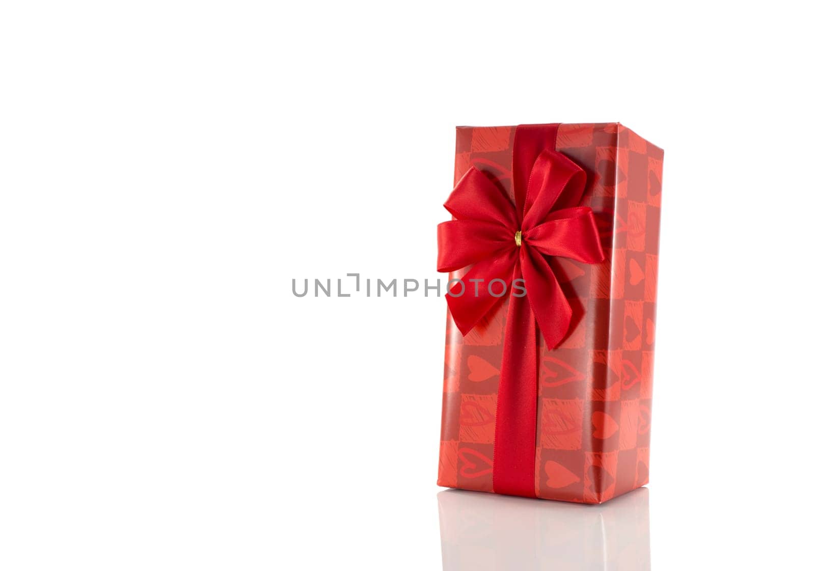 red wrapped present for mothers day or valentines isolated on white background