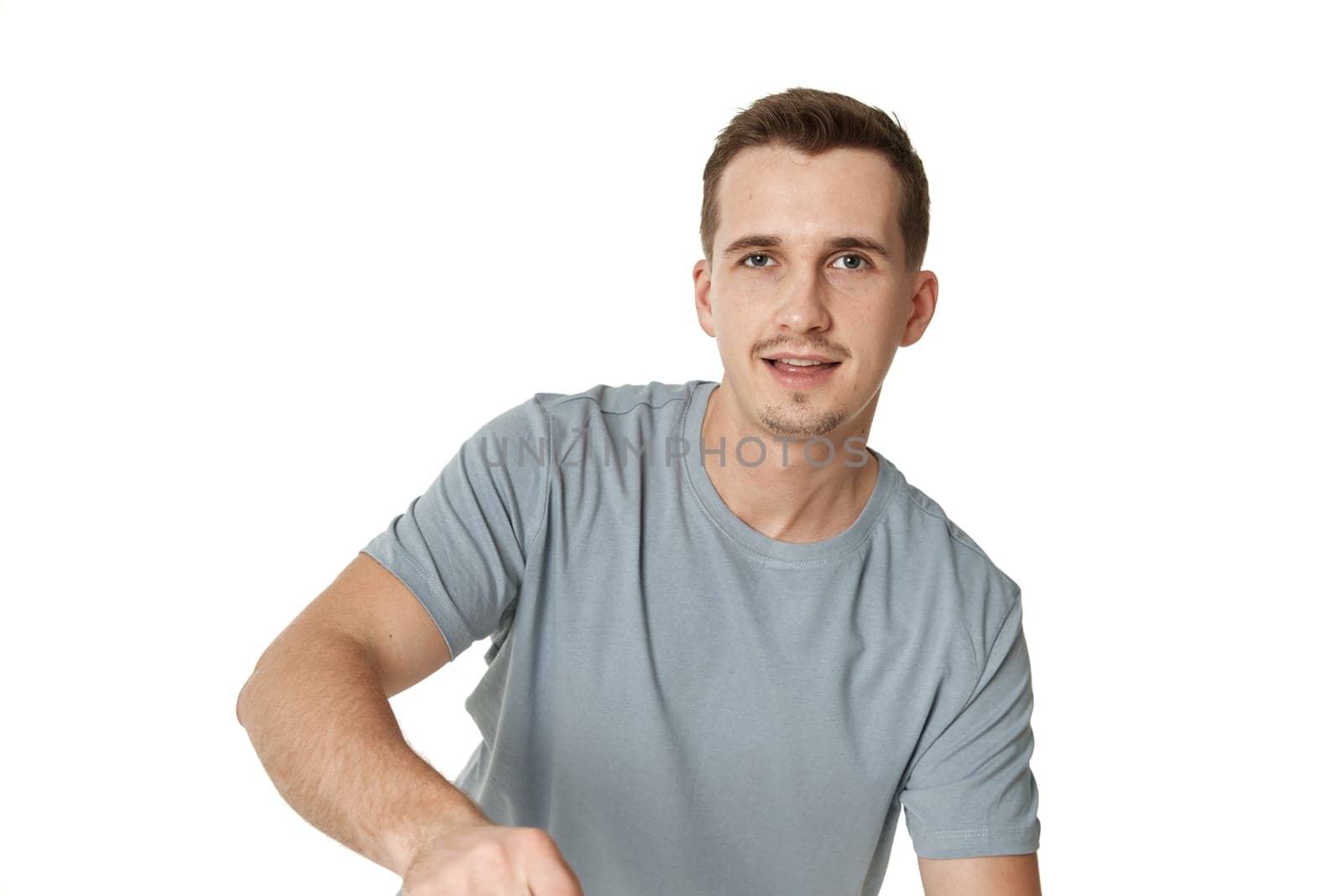 portrait of young smiling man on white background