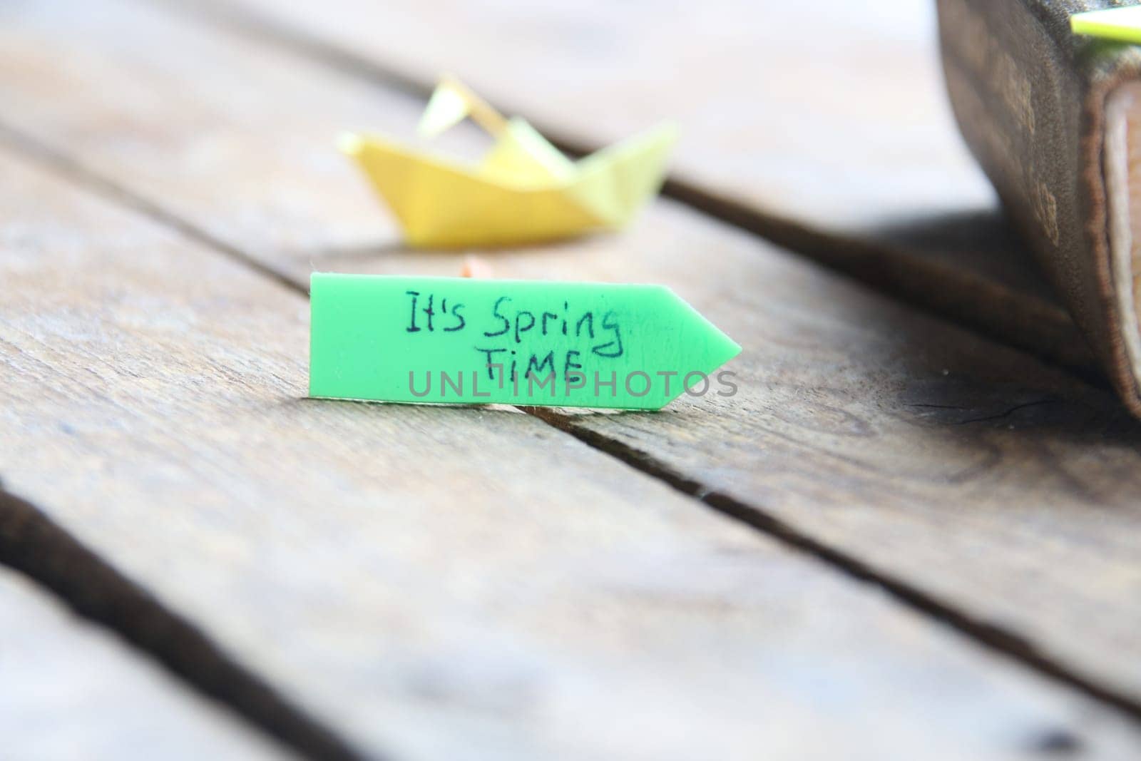 Origami paper boat and tag Its spring time.