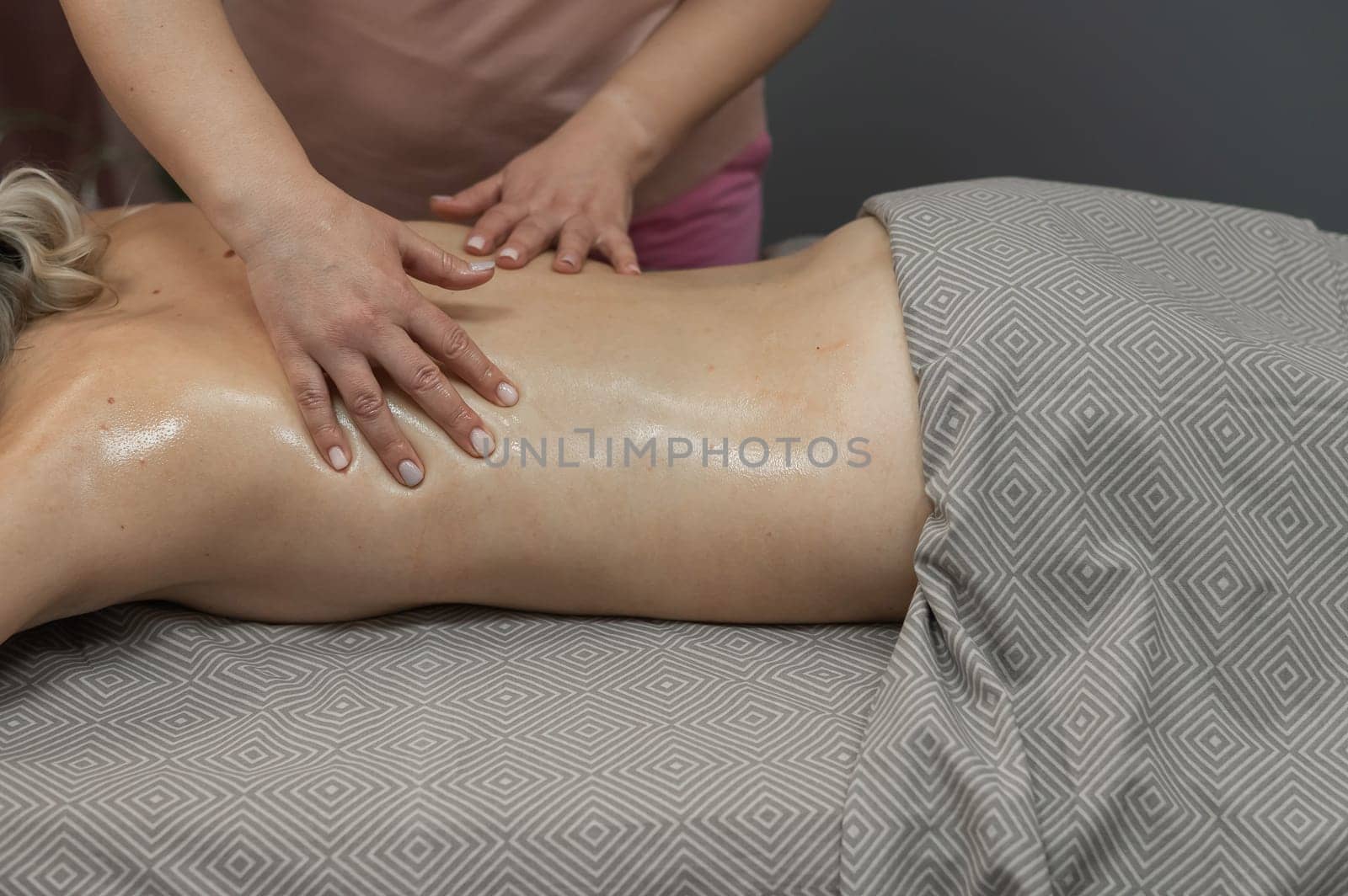 Woman having a therapeutic back massage