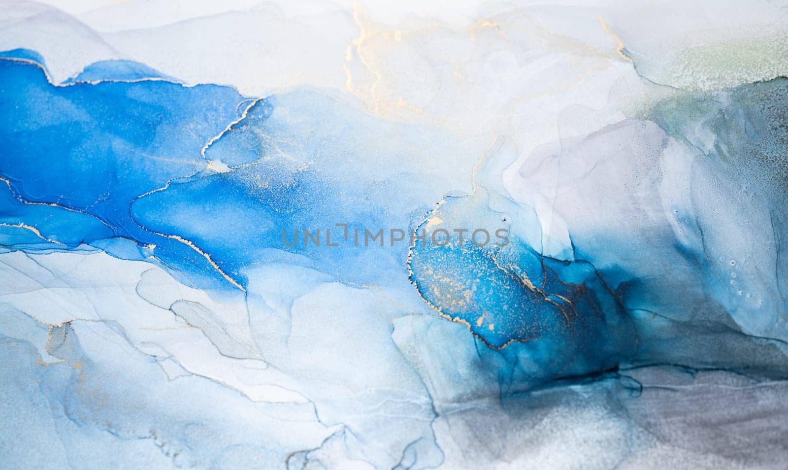 Abstract art with blue and gold background, beautiful smudges and stains made with alcohol ink. Abstract painting, background for wallpapers, posters, cards, invitations, websites.