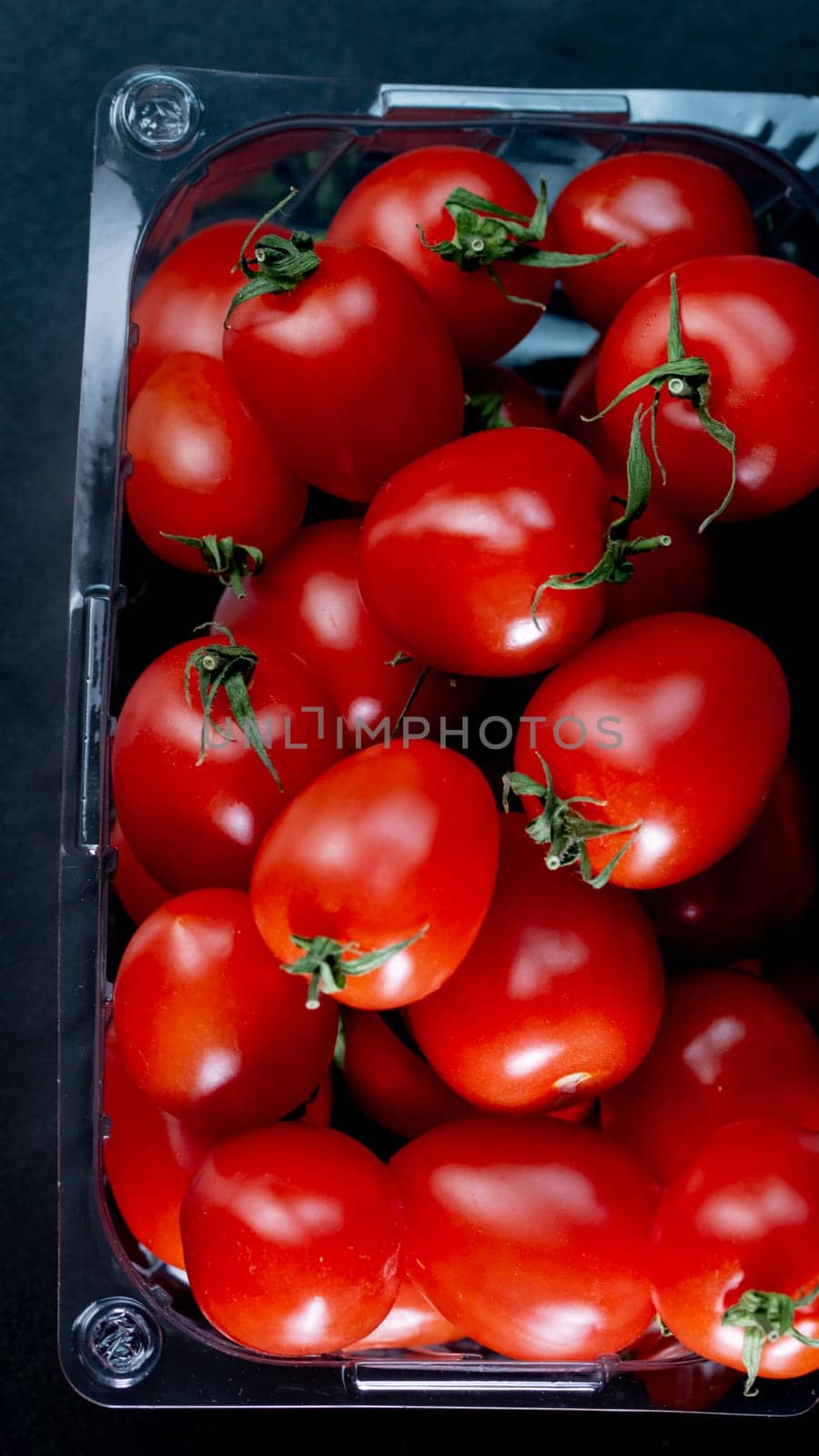 Selective focus on ripe delicious cherry tomatoes, close up by vladispas
