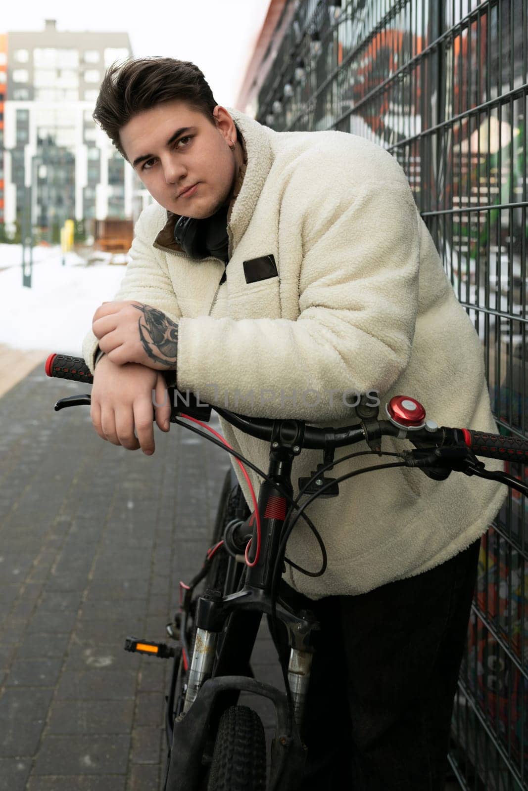 Sports concept, young man looking stylish with a bicycle by TRMK