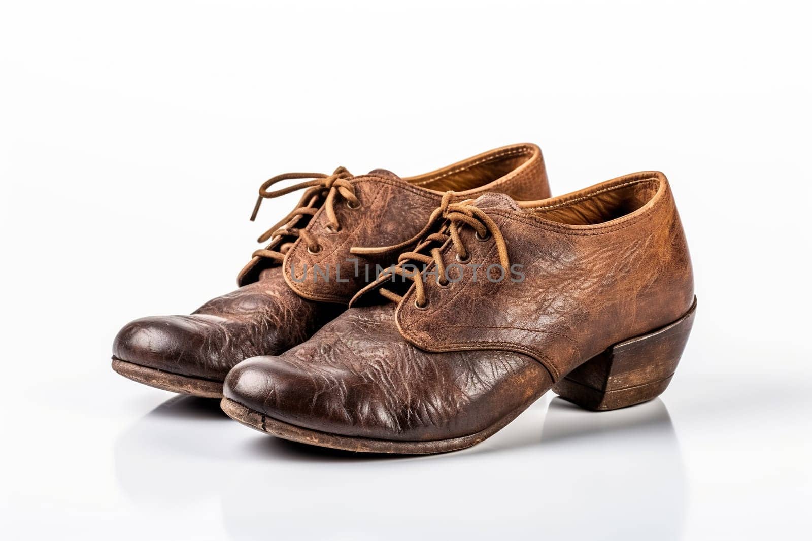 Old worn leather men's shoes on a white background. Generated by artificial intelligence by Vovmar
