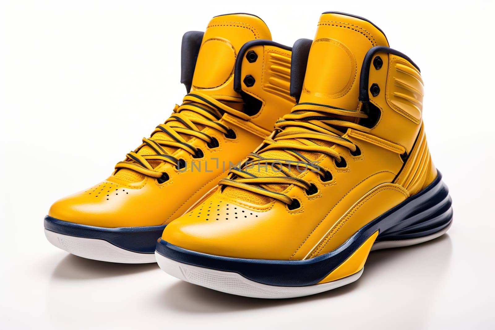 A pair of stylish yellow sneakers on a white background. Sports shoes.