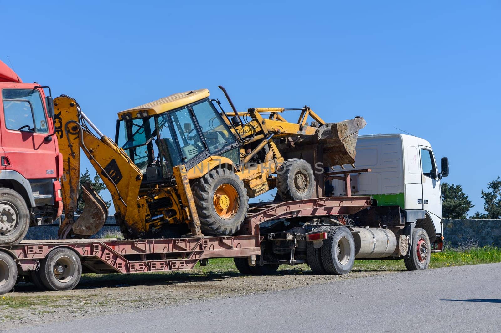 Gaziveren Cyprus 02.29.2024 - transportation of a tractor on a trailer 1