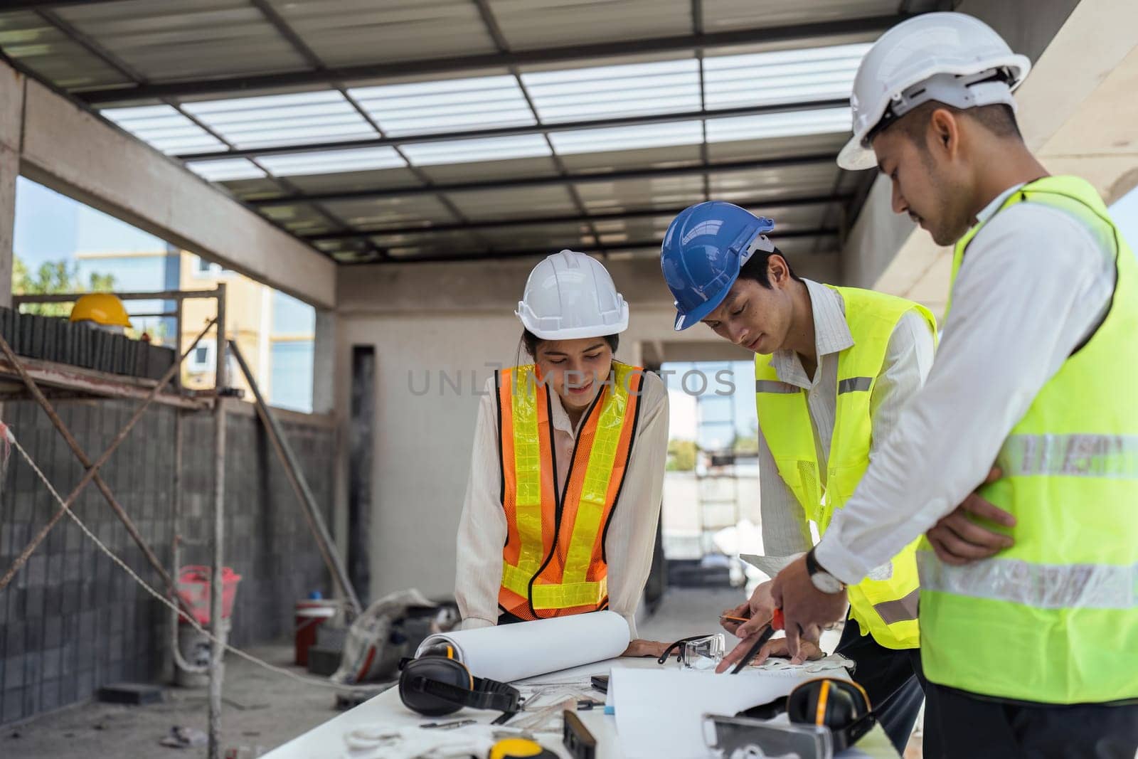 Two Specialists Inspect Commercial, Industrial Building Construction Site. Real Estate Project with Civil Engineer.