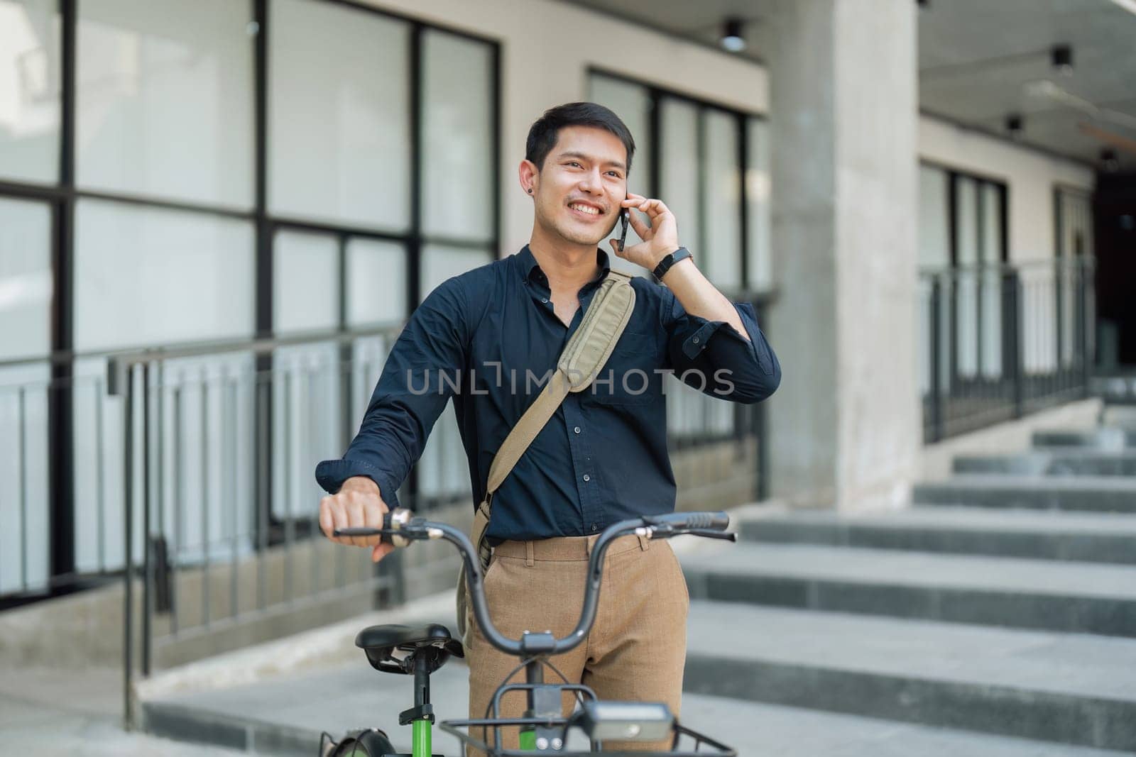 Businessmen ride bicycle to work to reduce carbon dioxide emissions and reduce global warming by itchaznong