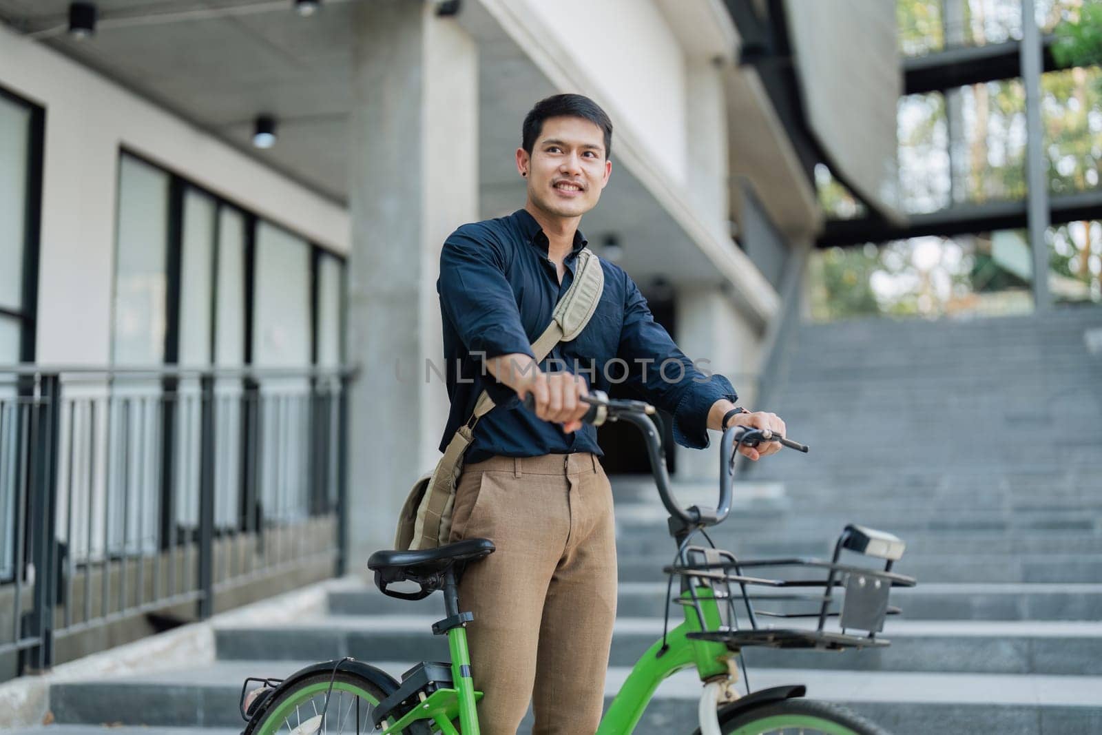 Businessmen ride bicycle to work to reduce carbon dioxide emissions and reduce global warming.