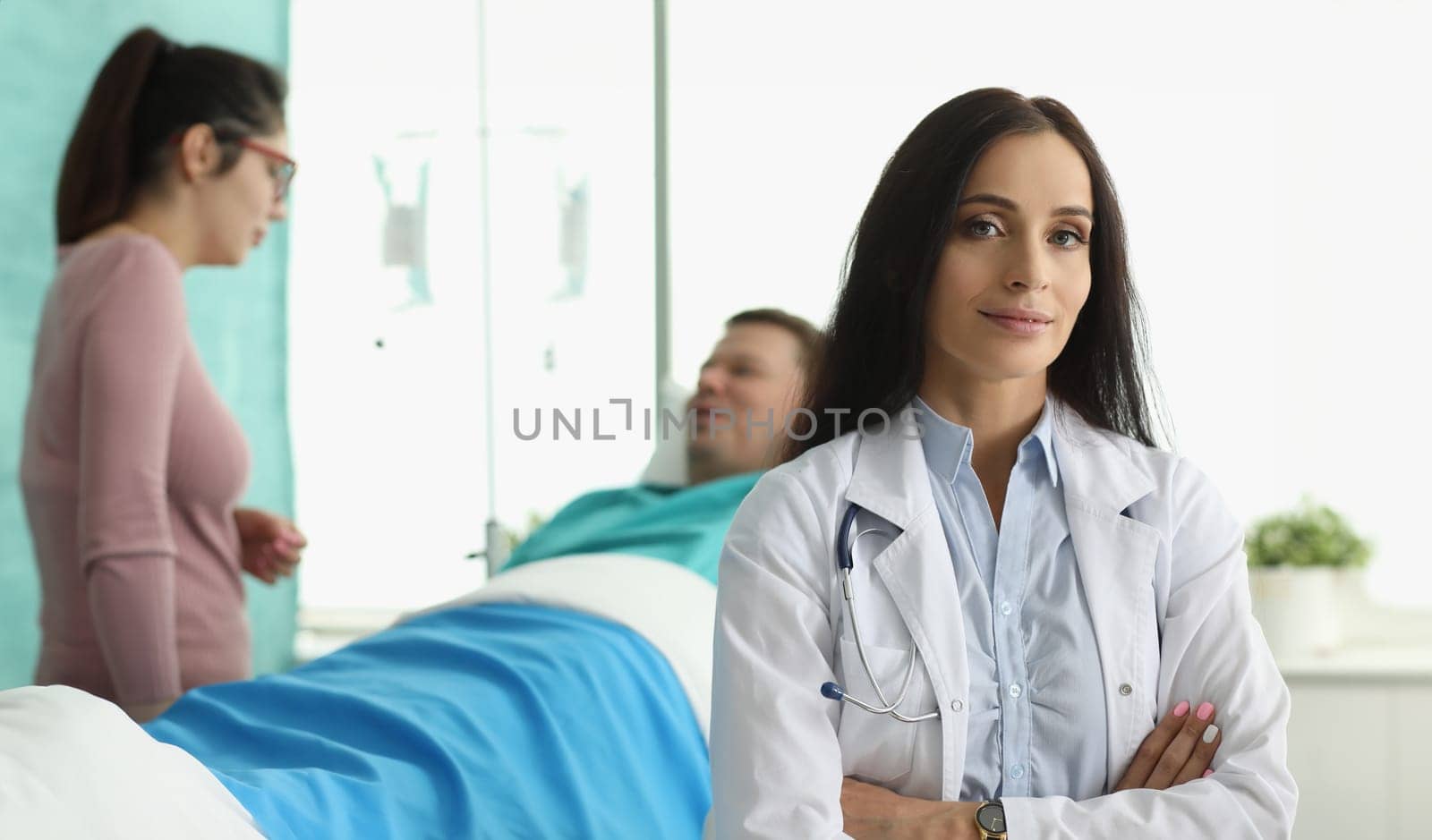 Man lies in hospital bed next to woman doctor. Range services for surgical treatment diseases varying complexity. Medicine use modern and proven practice diagnostic and treatment methods