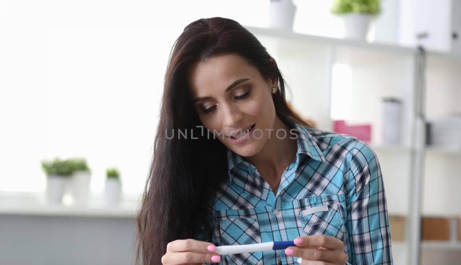 Girl has feeling surprise looking pregnancy test by kuprevich