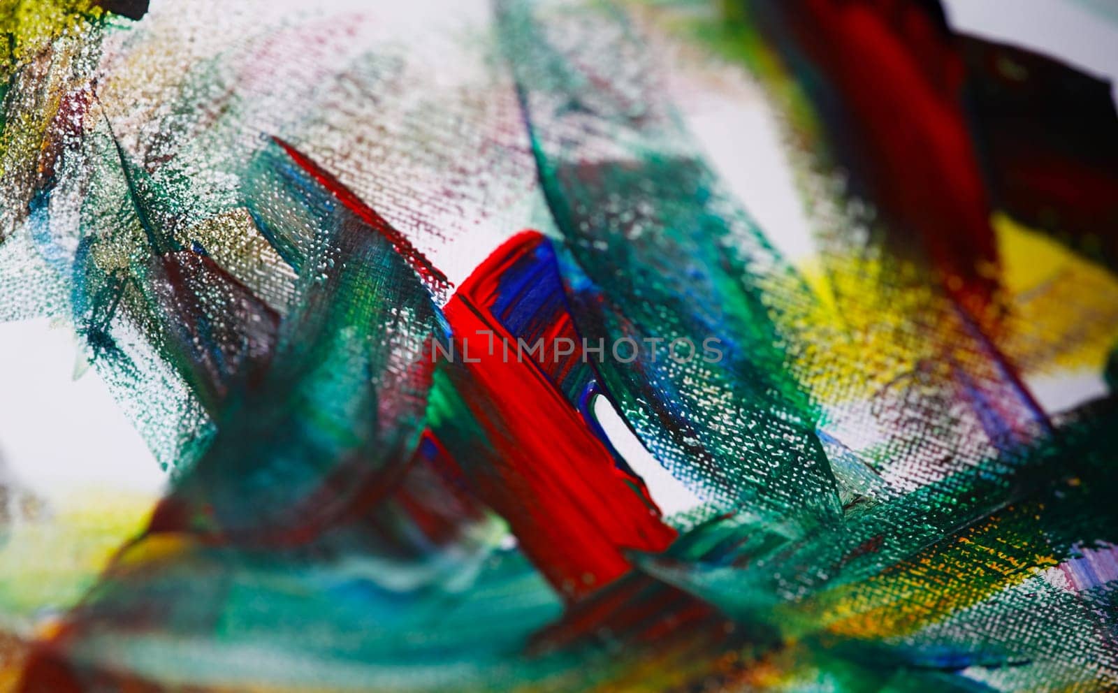 Close-up view of mixed colours on canvas. Chaos illustrated on painting. Fragment of artwork. Oil or gouache palette. Self-expression on paper. Modern art and creativity concept