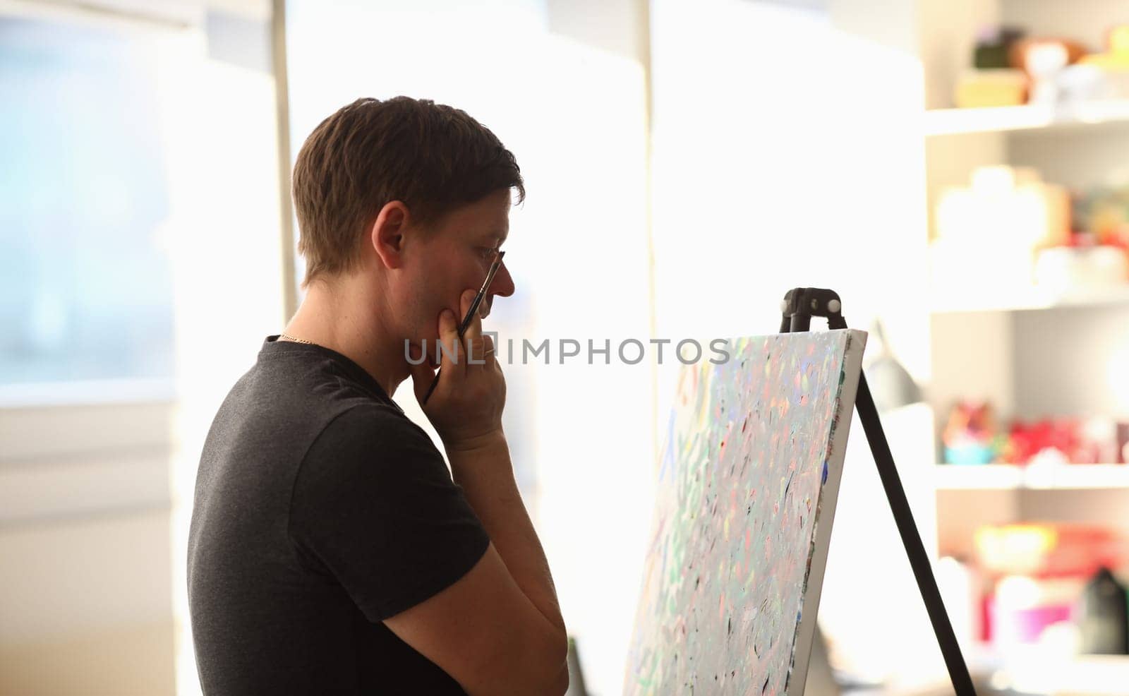 Male painter and creative process by kuprevich