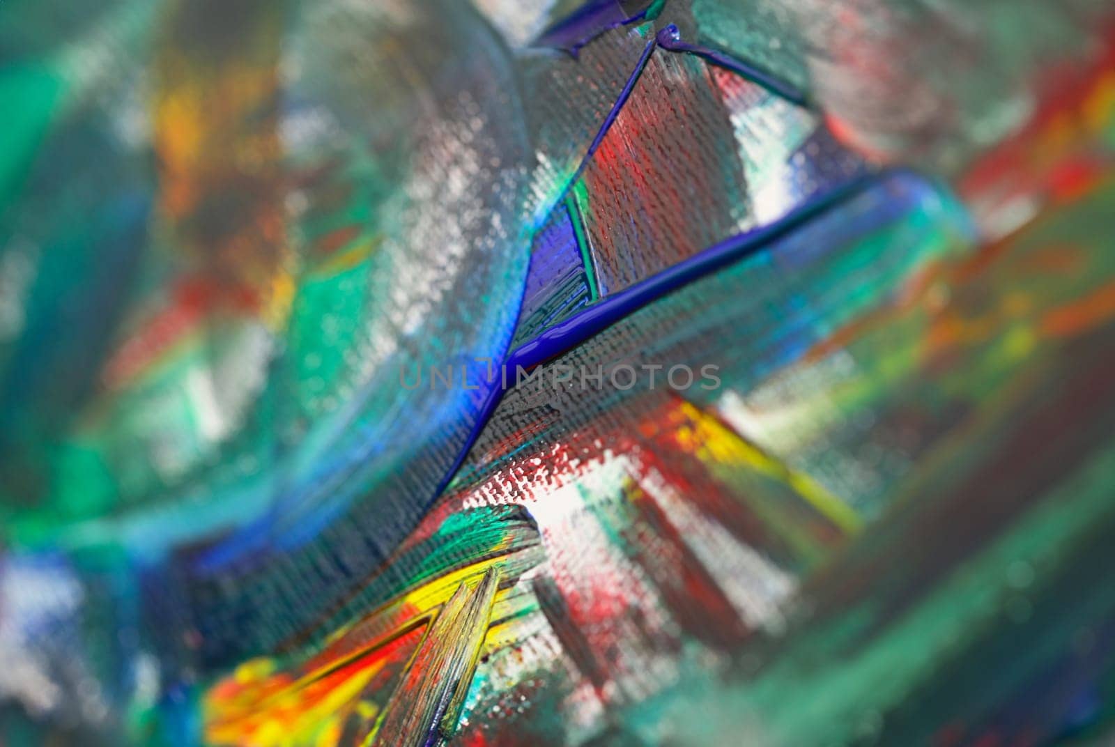 Close-up view of abstract oil paint texture on canvas. Macro shot of artistic painting palette. Artwork and modern art concept. Colourful brush strokes on fragment