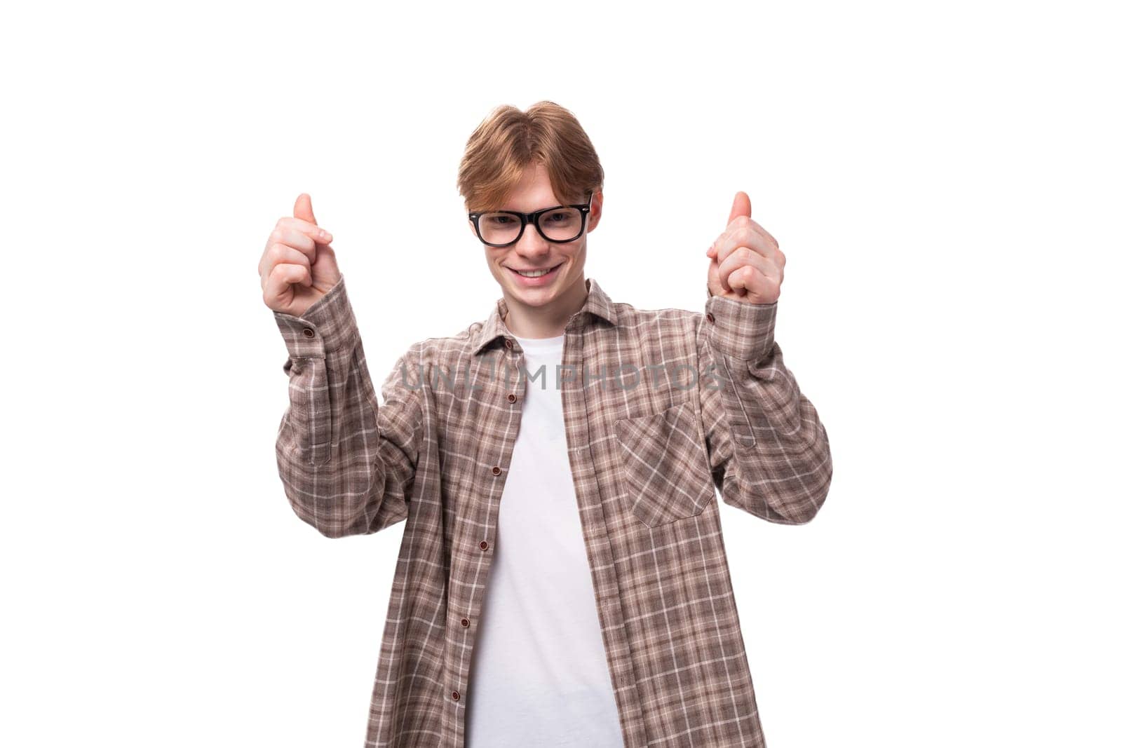 portrait of a young joyful european red-haired guy with glasses on a white background by TRMK