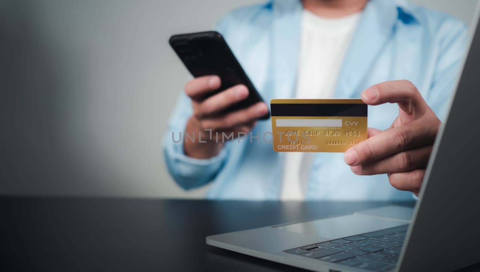 Online payment, Man using computer and credit card for online shopping, Digital online payment concept, Technology online banking applications via internet network, financial transaction. by Unimages2527