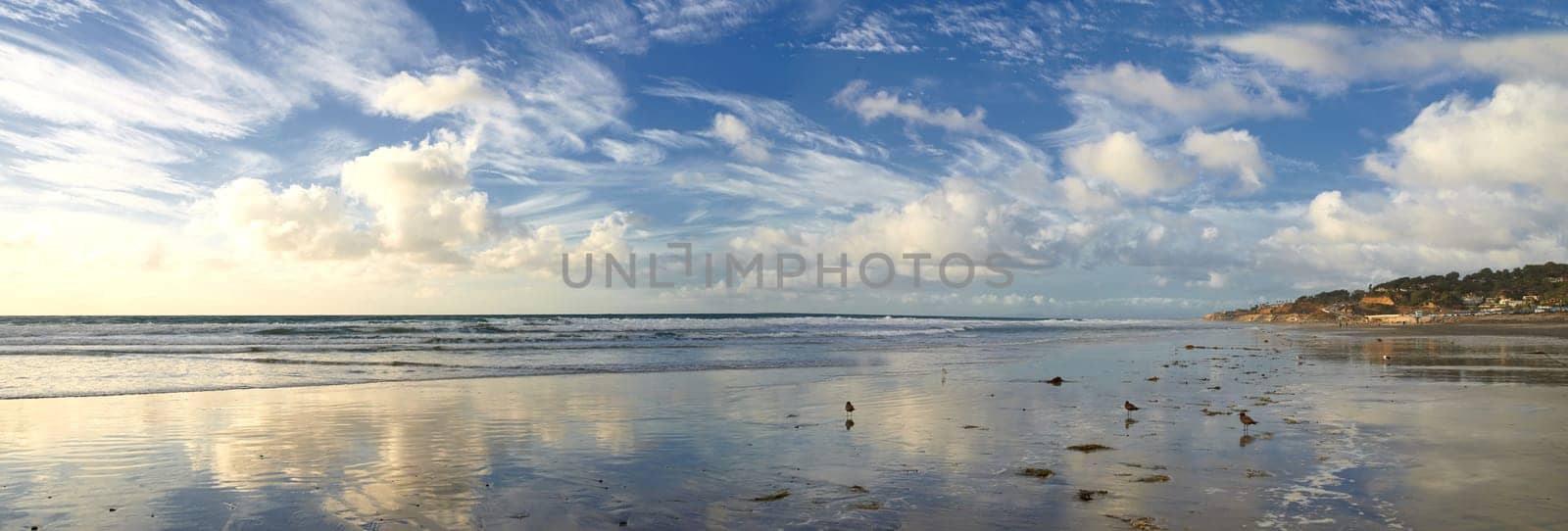 Blue sky, ocean and landscape of beach in California for tropical holiday, vacation and travel destination. Nature, island and sea, waves and water in summer for location, background and horizon.