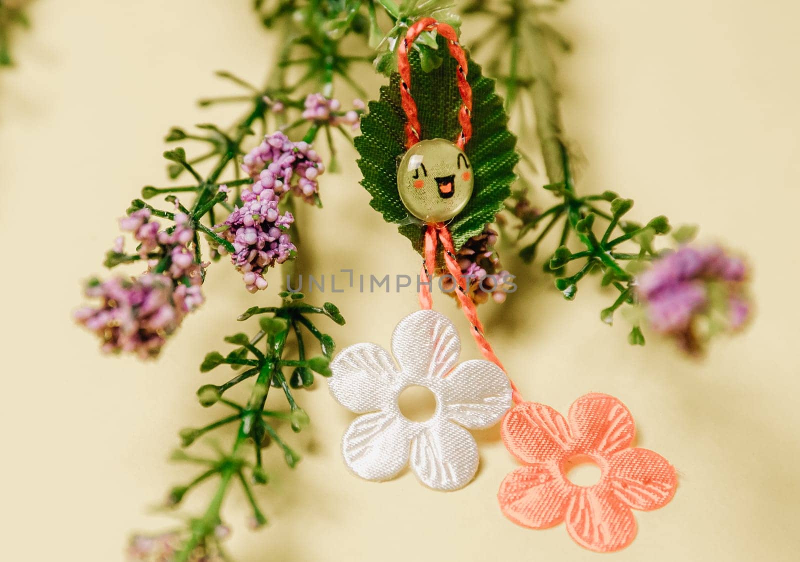 One beautiful floral martisor with spring flowers on a yellow background. by Nataliya