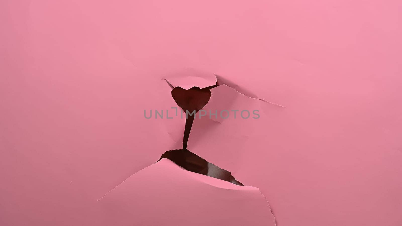 Torn pink paper background. Copy space