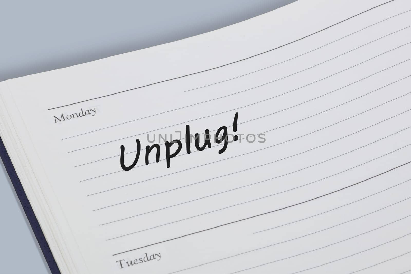 An Unplug reminder message in an open diary