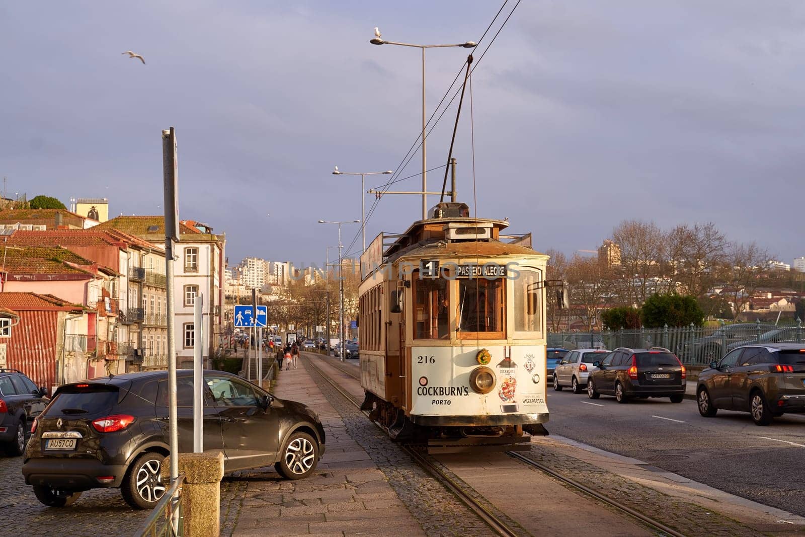 Porto, Portugal. Traditional vintage tram passes through the historical Linha 1 tram line by berezko