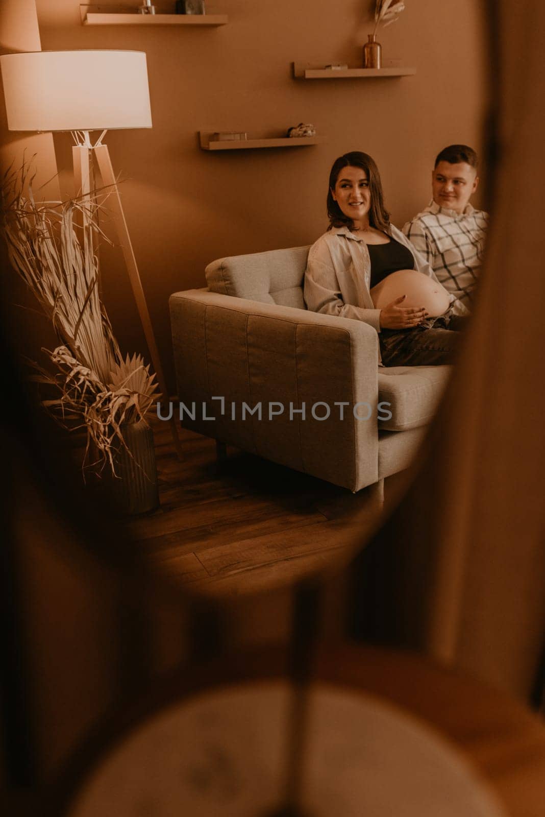 an incredibly beautiful married couple Expecting child, pregnant wife. Happy parenthood, real Ukrainian young family. romantic, gentle, stylish photo session of married couple. pregnant woman in love