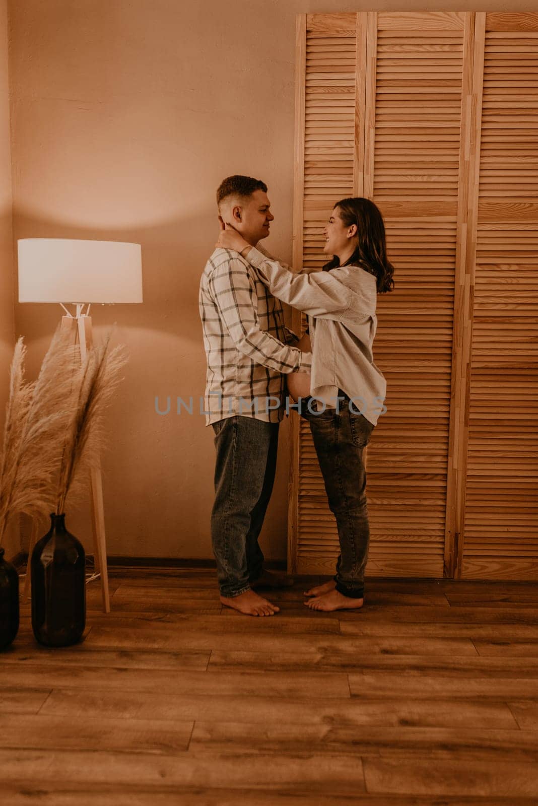 an incredibly beautiful married couple Expecting child, pregnant wife. Happy parenthood, real Ukrainian young family. romantic, gentle, stylish photo session of married couple. pregnant woman in love
