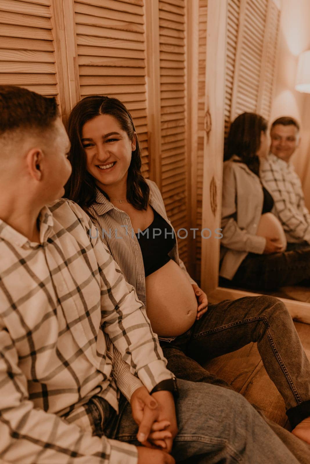 an incredibly beautiful married couple Expecting child, pregnant wife. Happy parenthood, real Ukrainian young family. romantic, gentle, stylish photo session of married couple. pregnant woman in love