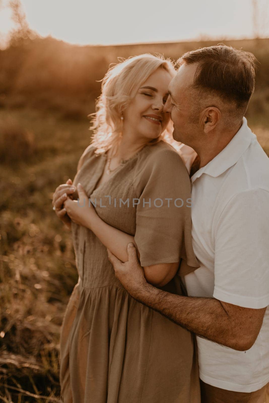 happy married couple mature people together for long time, secret of strong family relationships, cheerful joyful husband and wife together in harmony. middle-aged couple walking in nature at summer