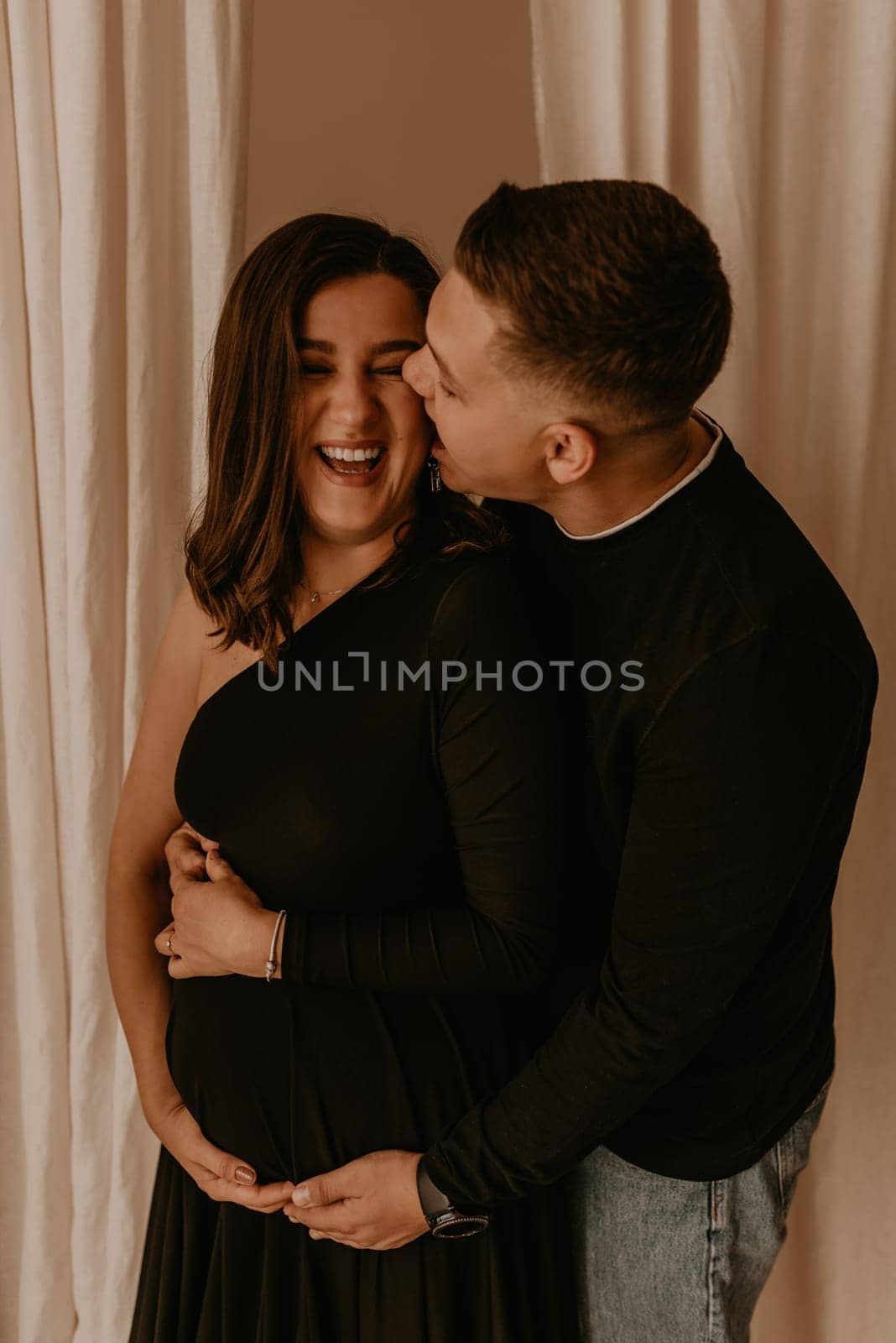 an incredibly beautiful married couple Expecting child, pregnant wife. Happy parenthood, real Ukrainian young family. romantic, gentle, stylish photo session of married couple. pregnant woman in love