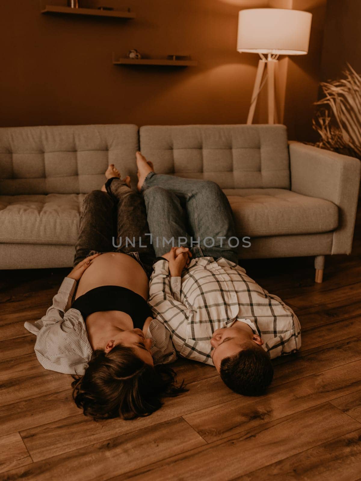 an incredibly beautiful married couple Expecting child, pregnant wife. Happy parenthood, real Ukrainian young family. romantic, gentle, stylish photo session of married couple. pregnant woman in love