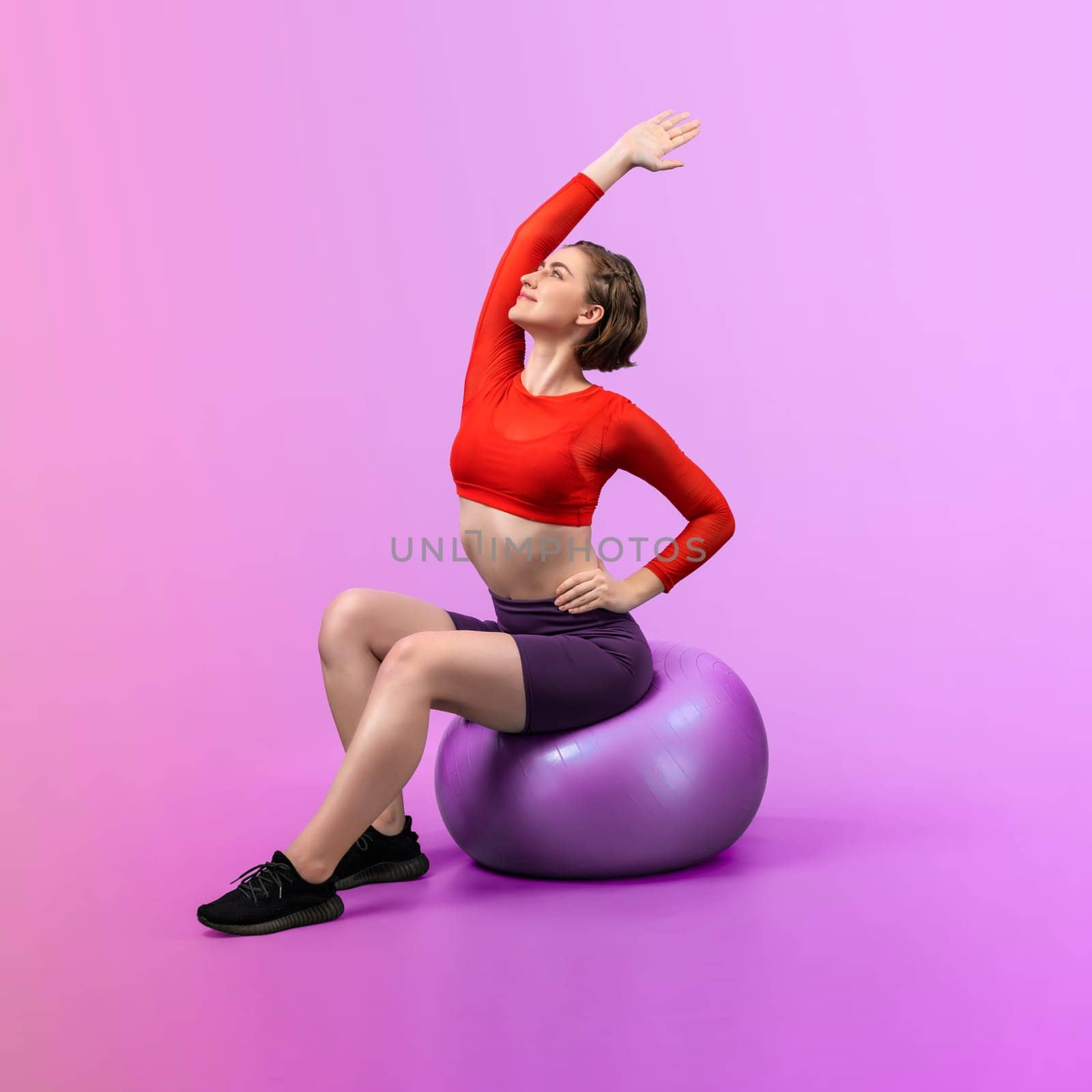 Full body length gaiety shot athletic and sporty young woman with fitness ball by biancoblue
