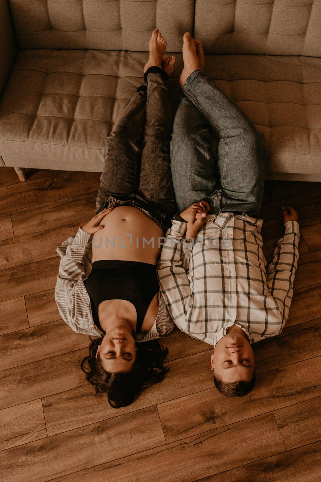 an incredibly beautiful married couple Expecting child, pregnant wife. Happy parenthood, real Ukrainian young family. romantic, gentle, stylish photo session of married couple. pregnant woman in love