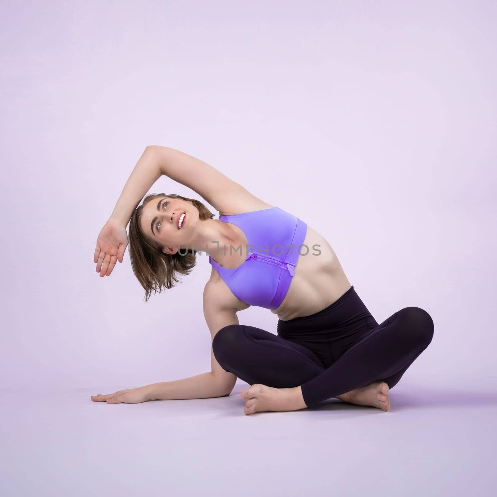 Full body length gaiety shot athletic and sporty woman doing yoga by biancoblue