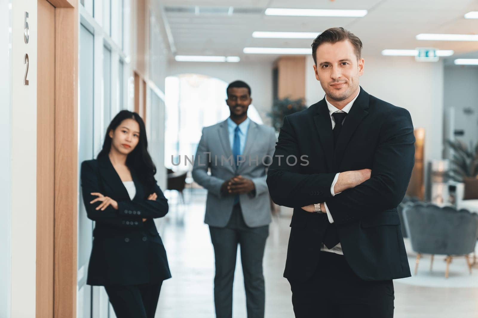 Businessman standing with arm folded while coworker stand behind. Ornamented. by biancoblue