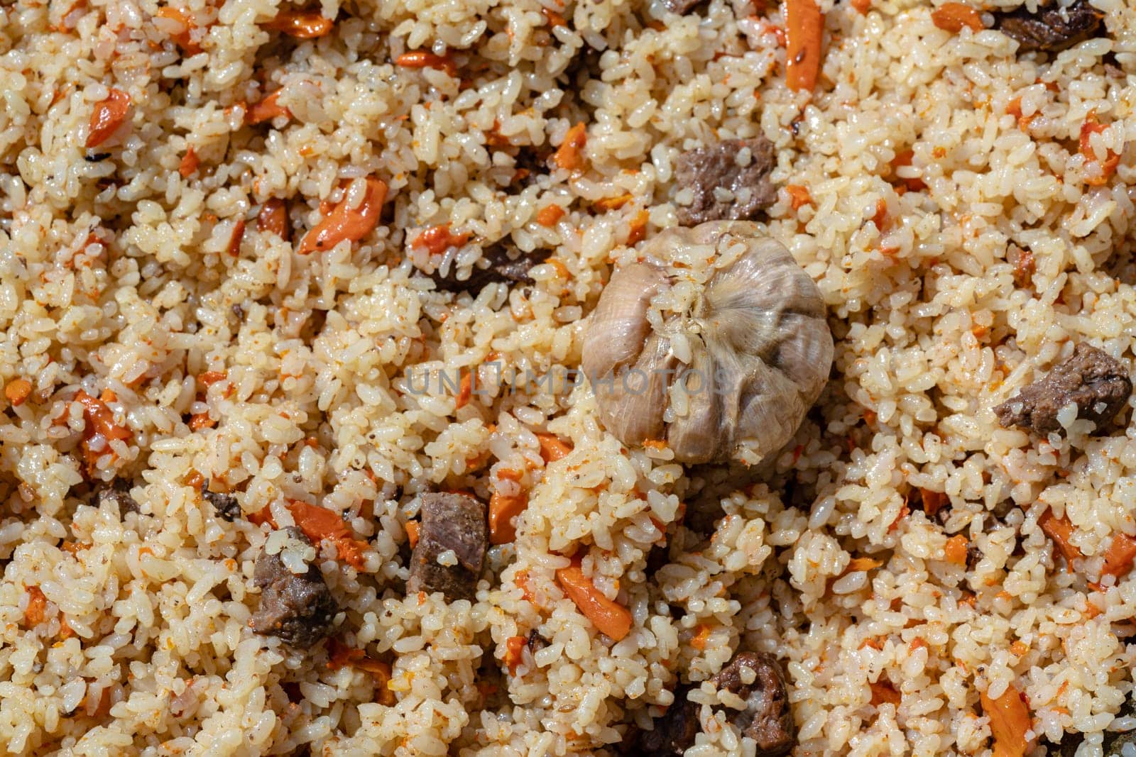 Traditional Asian culinary dish - pilaf. Ingredients: rice with slices of meat by Alexander-Piragis