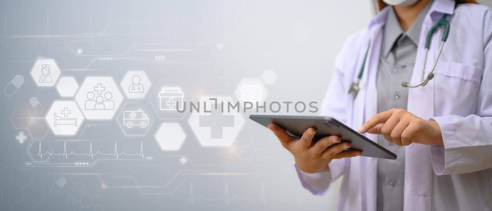 Medical technology concept. Doctor in white coat using digital tablet with medical icons network connection by prathanchorruangsak