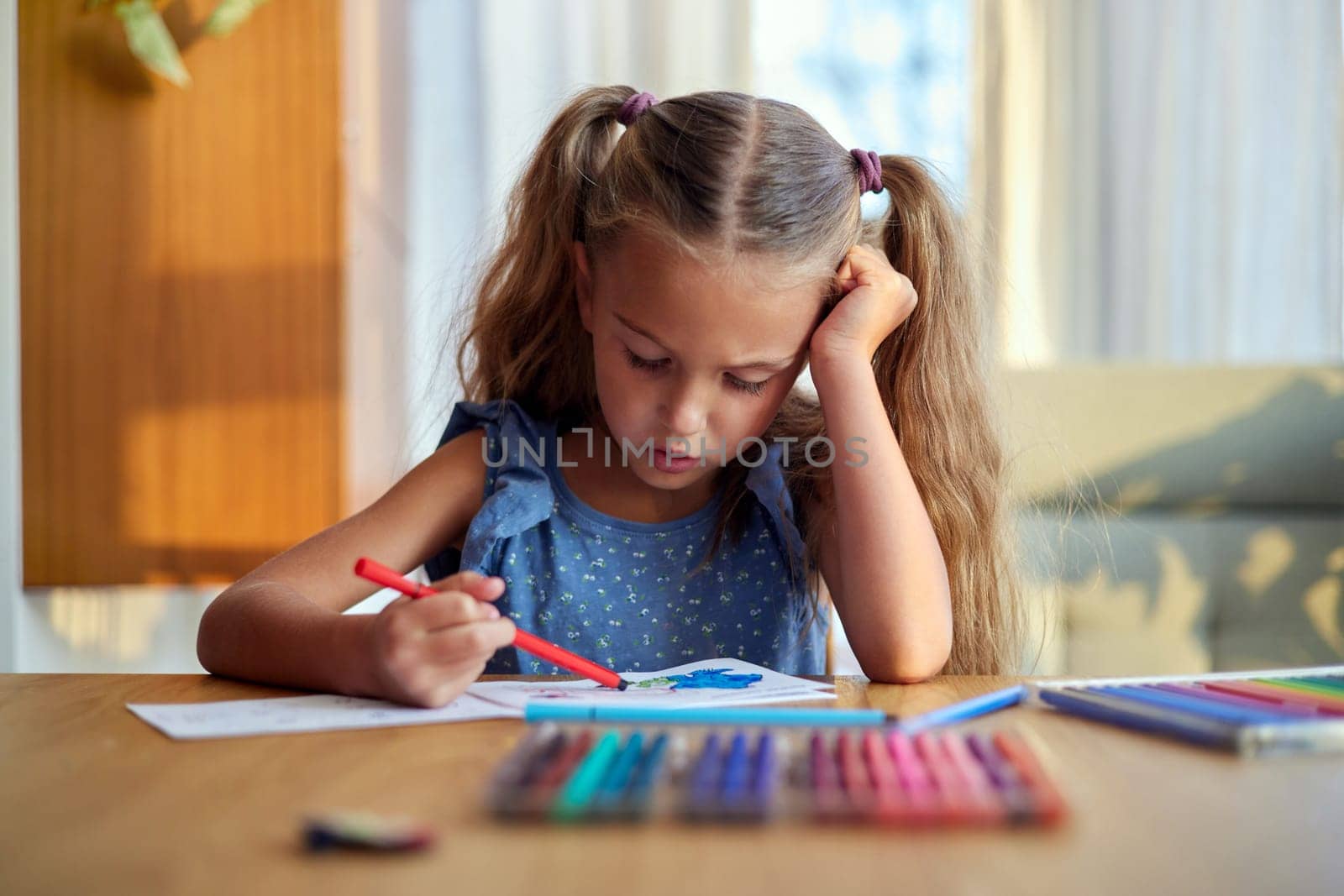 Concentrated girl painting with colorful pencils by Demkat