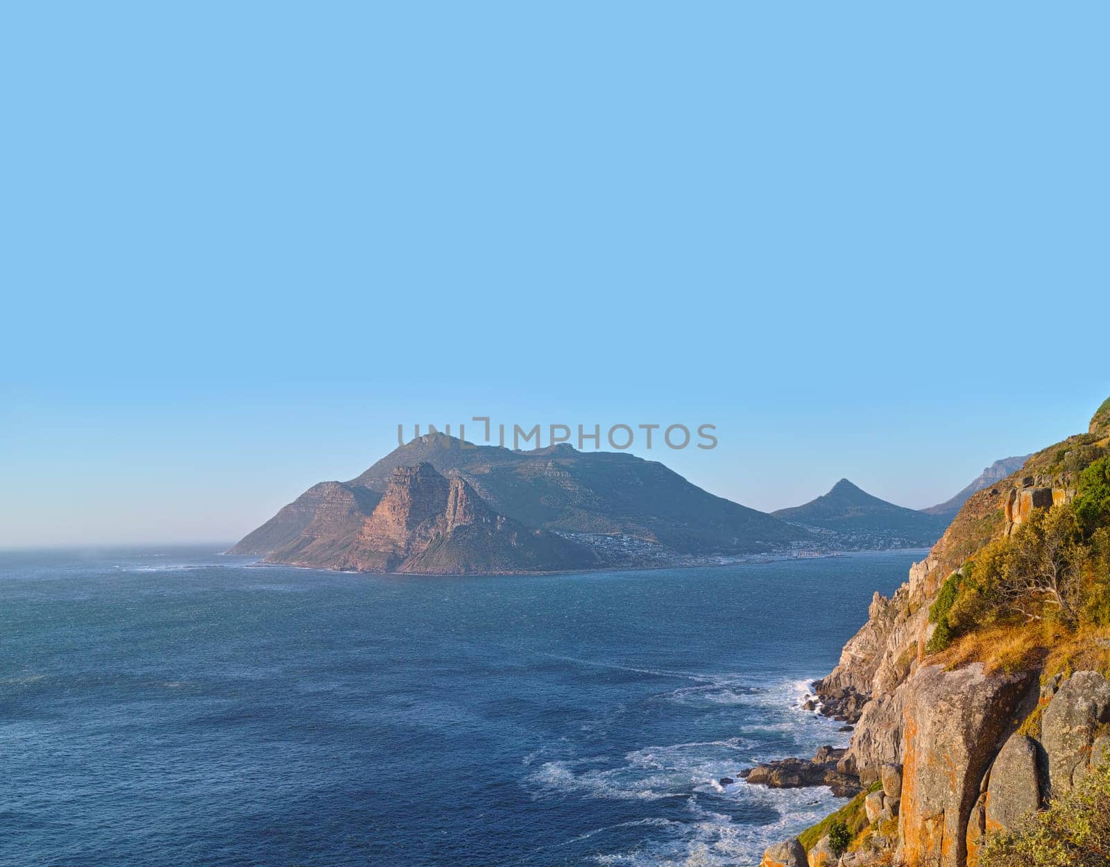 Beach, drone and mountain in island, paradise and tourist destination for summer vacation in nature. Aerial, ocean and blue in sky in cape town, peace and outdoor travel of sustainable environment by YuriArcurs