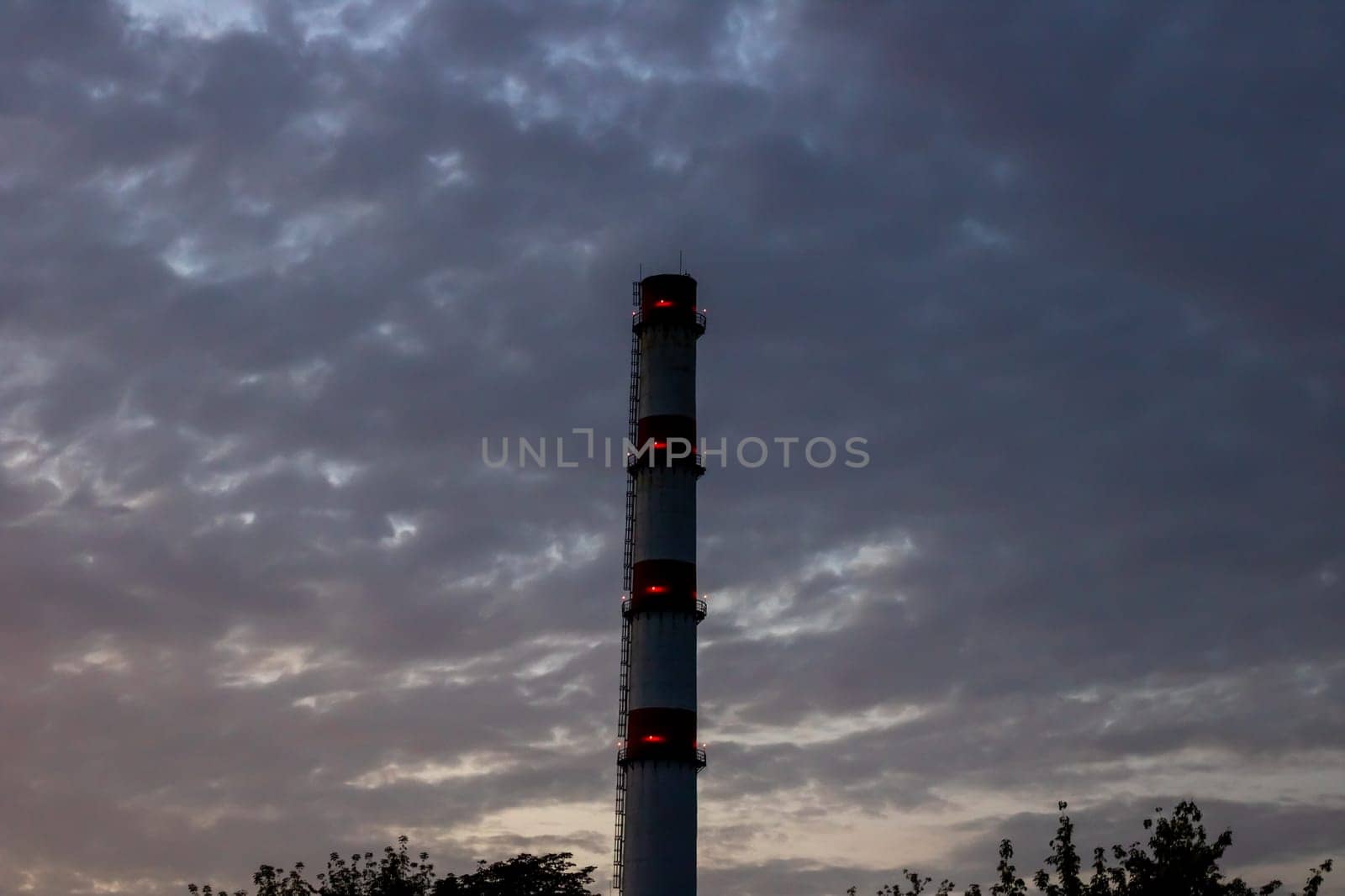 Brick chimney of factory on background of blue sky by Vera1703