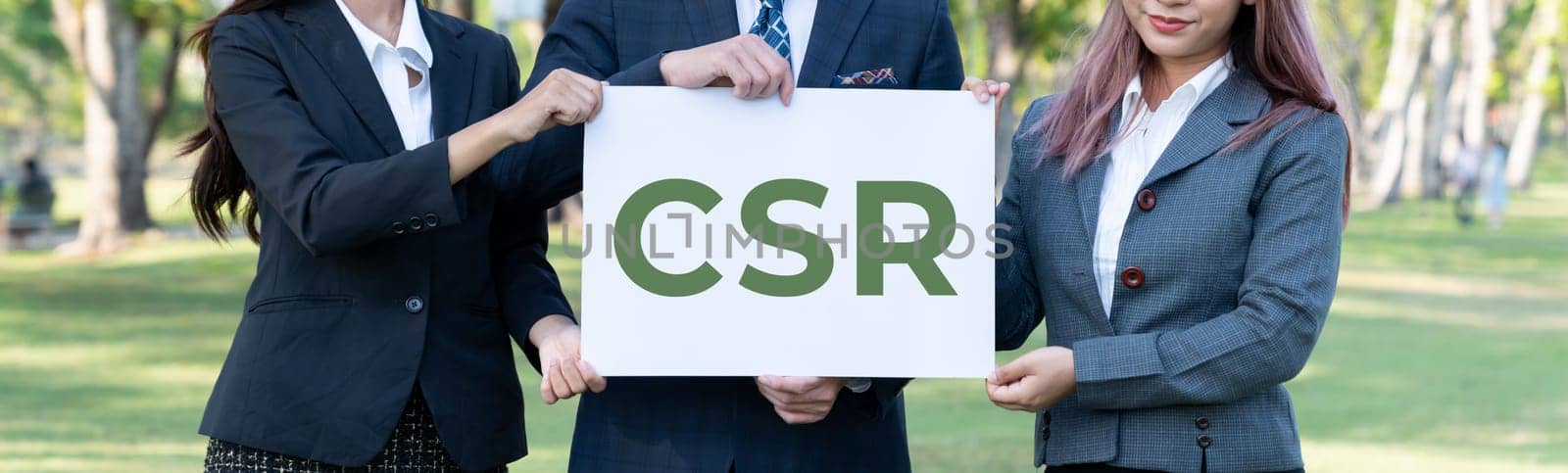 Group of business people stand, holding eco-friendly idea and concept for environmental awareness campaign on corporate social responsible to protect environment and nature with CSR principle. Gyre